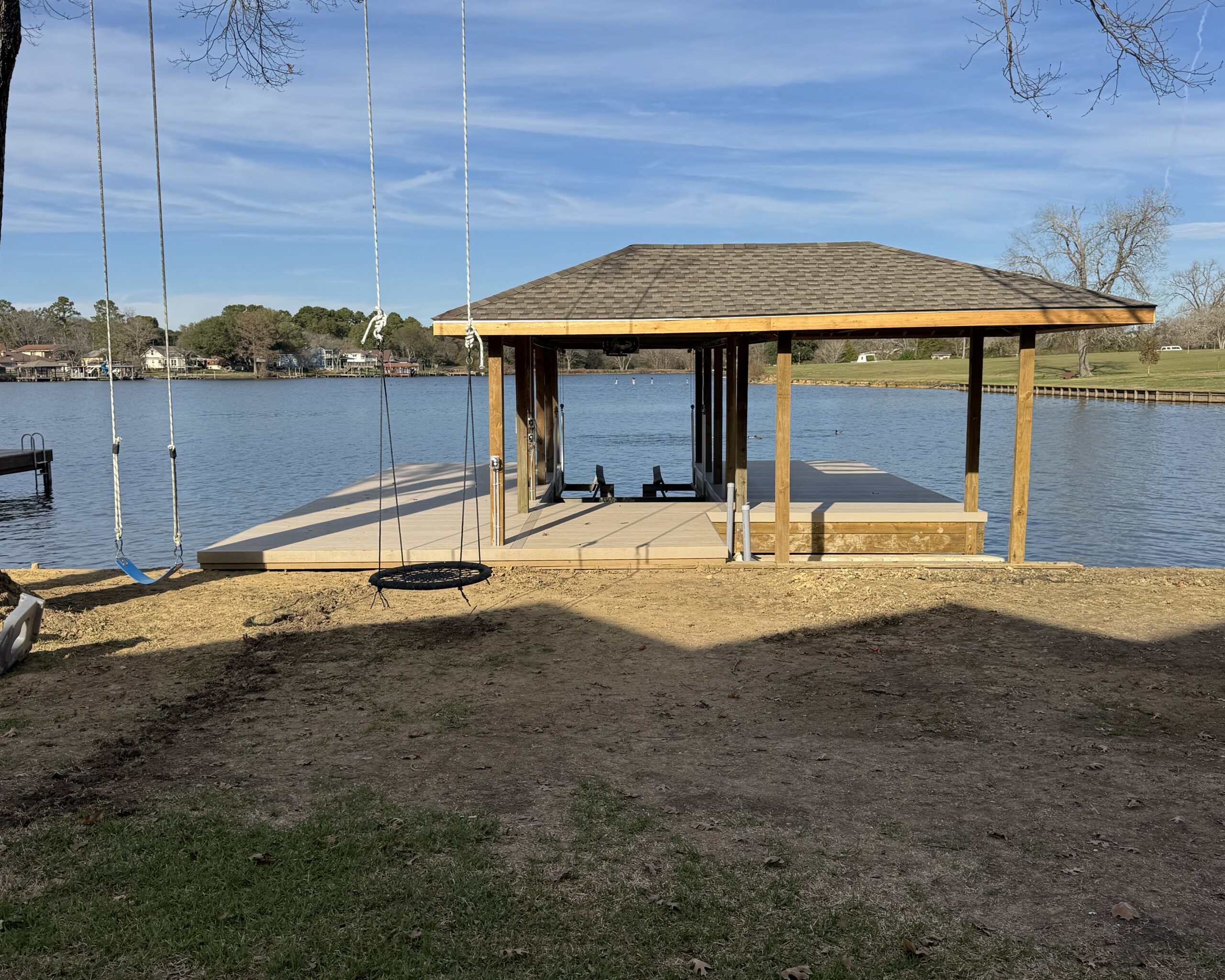 Boat-House-Lake-Conroe-Lake-Livingston green grass at shore